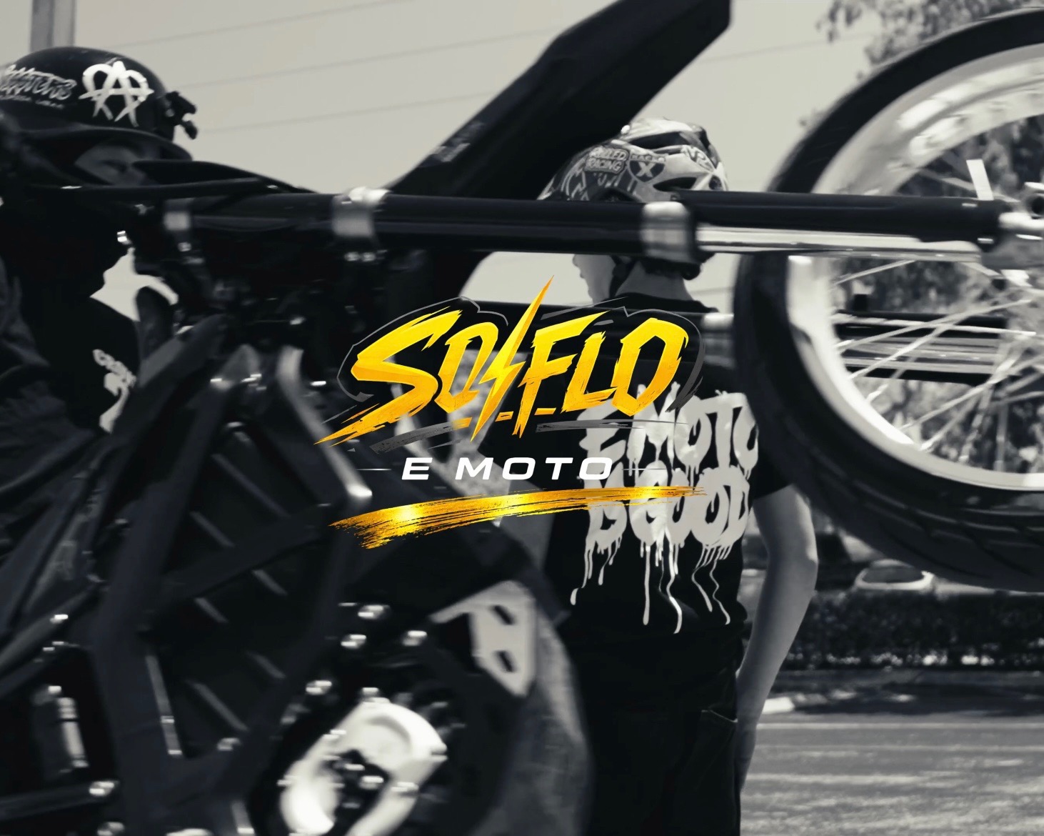 Black and white SoFlo E-Moto rider scene with merch branding and a centered SoFlo E-Moto logo.